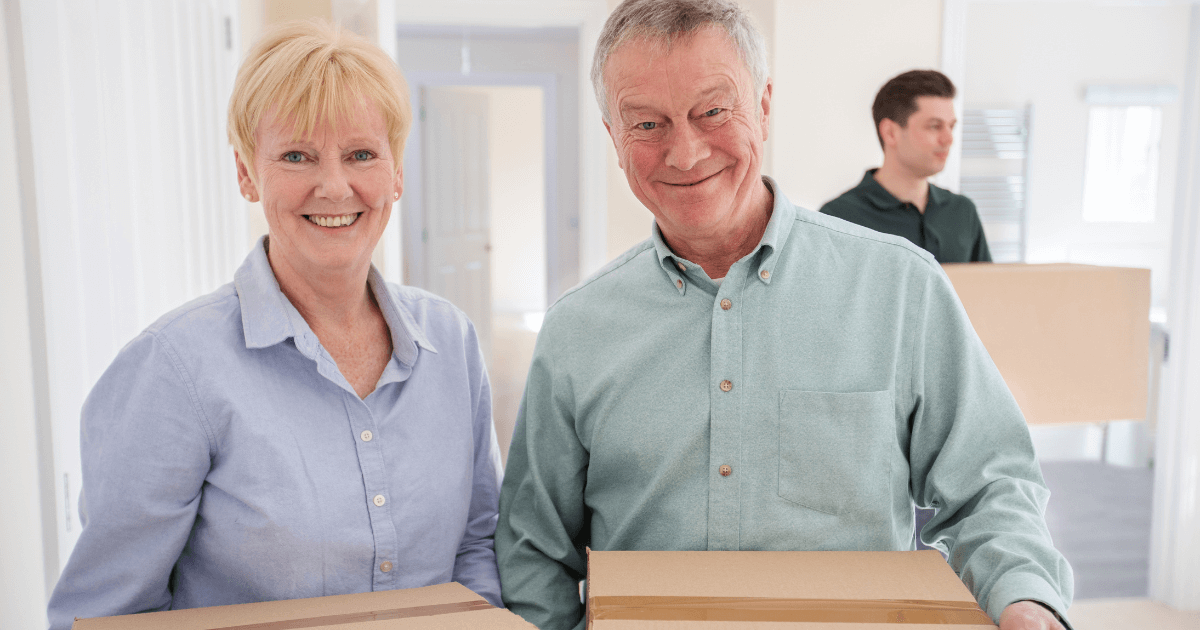 7 Benefits of Downsizing to Senior Living Elder couple with moving boxes